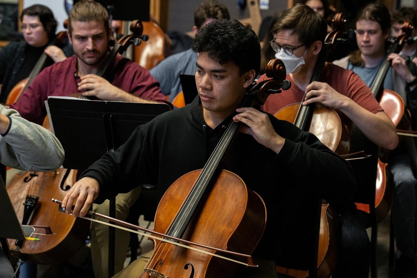 School of Music and Dance students playing instruments in an orchestra