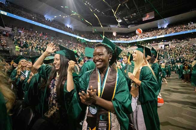 Graduates celebrating at the end of the commencement ceremony