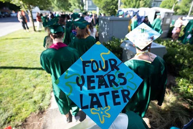 Mortar board that says Four Years Later