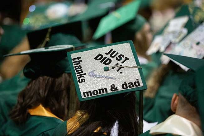 Mortar board that says Just Did It! Thanks mom and dad