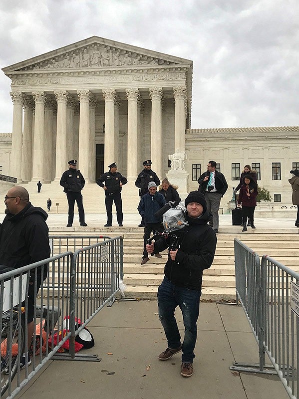 Adam Markle in front of the Supreme Court of the United States.