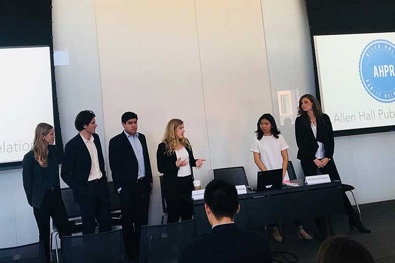 Students presenting about Allen Hall PR