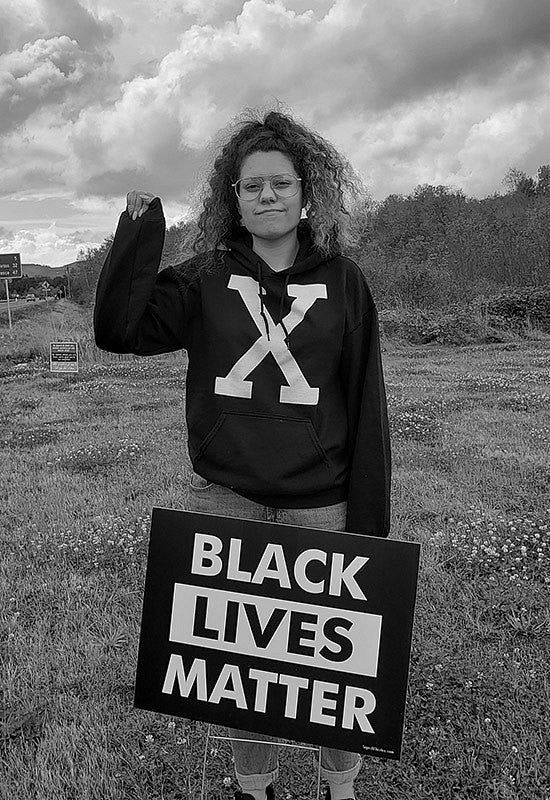 Mya Lansing with a Black Lives Matter sign