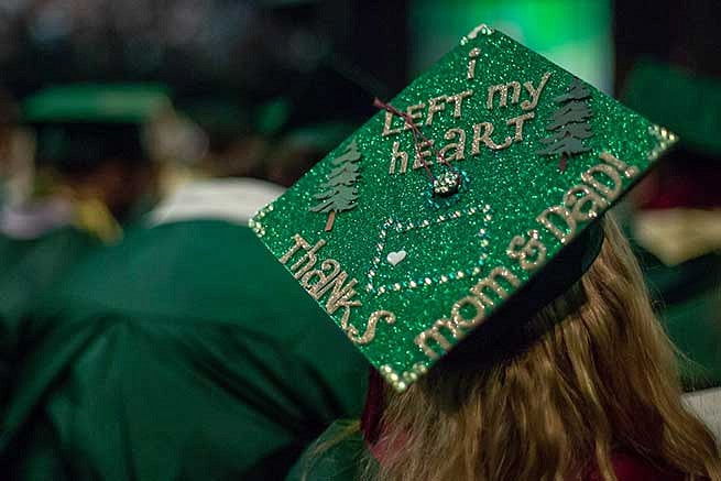 Graduation cap reads: I left my heart in Oregon. Thanks mom and dad.