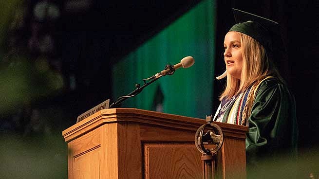 ASUO student president Amy Schenk took a moment to congratulate students on their separate journeys to getting to graduation