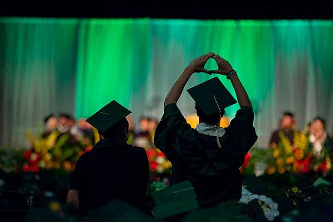 Student throws the O in Matt Knight Arena