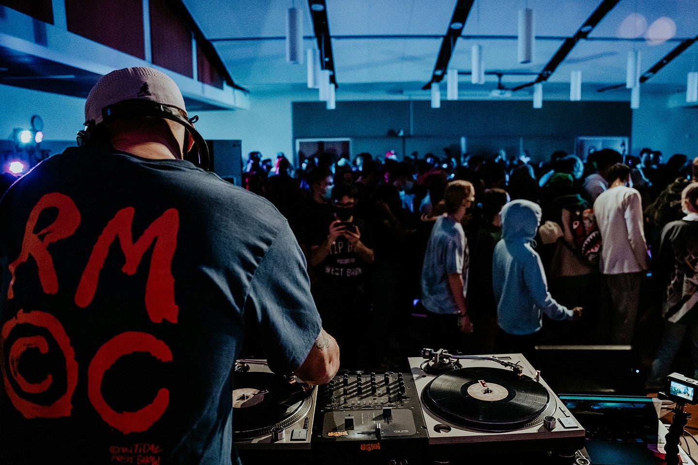 Shot of the crowd over shoulder of DJ food stamp