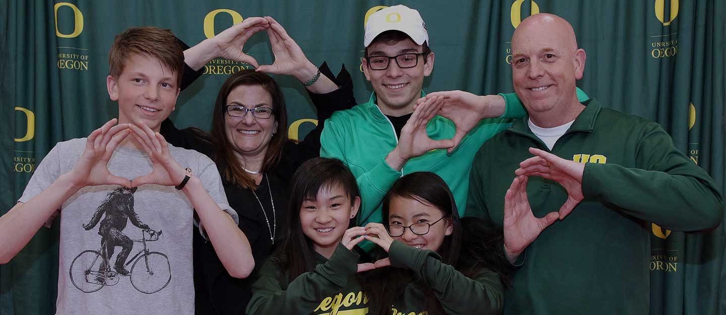 Hayden Dentinger (center, rear) and his family at the Stamps Signing Day event at Klamath Union High School