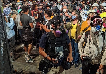 Mason Trinca covering protests in Portland