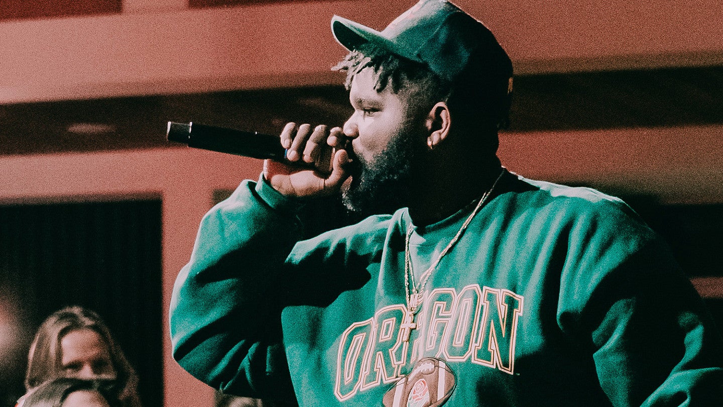 Mic Capes on stage at the UO Hip Hop Jam