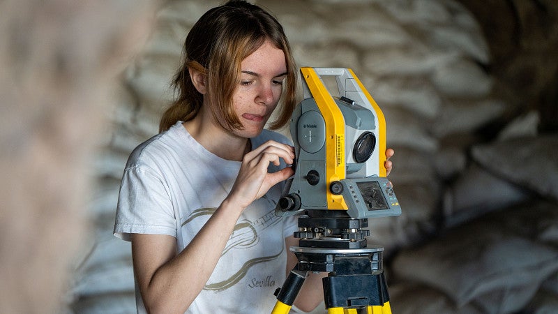 student using camera equipment with her research