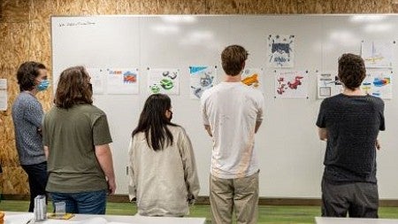 Students in Faste's design class critique their sketches