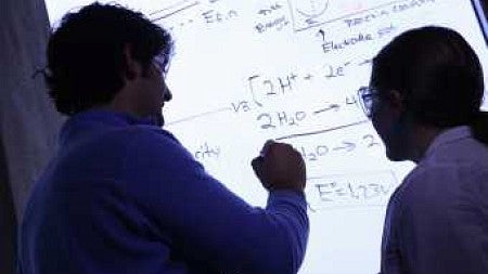 Shannon Boettcher in his lab with Lena Trotochaud, a graduate teaching fellow. Photograph by Michael McDermott