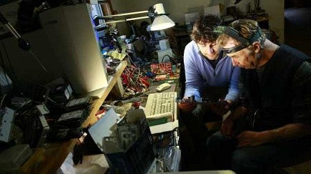 Shannon and Jim Boettcher ay Jim's workbench in Creswell. Photograph by Michael McDermott
