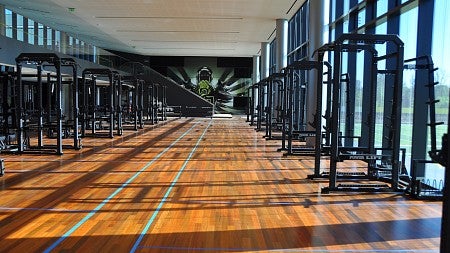 The floor of the 25,000-square-foot weight room is clad in ipe (ee-pay), a super durable, South American hardwood. Photograph courtesy ZGF Architects