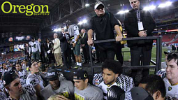 As players celebrate their victory over KSU in the 2013 Fiesta Bowl, head coach Chip Kelly (in visor, of course) looks to the future. Photograph by Jack Liu