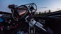 Pine Mountain Observatory telescope open to the stars at night