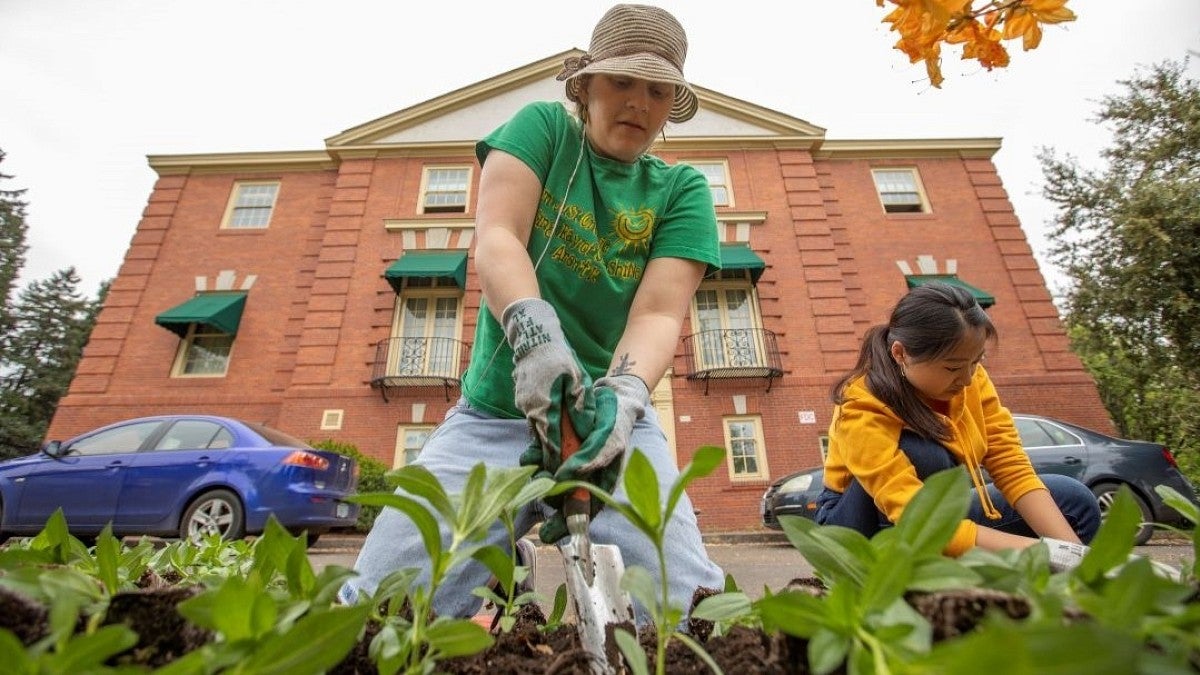 people planting flowers for University Day