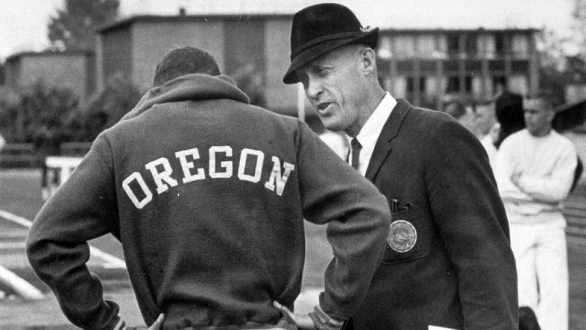 Bill Bowerman with track athlete