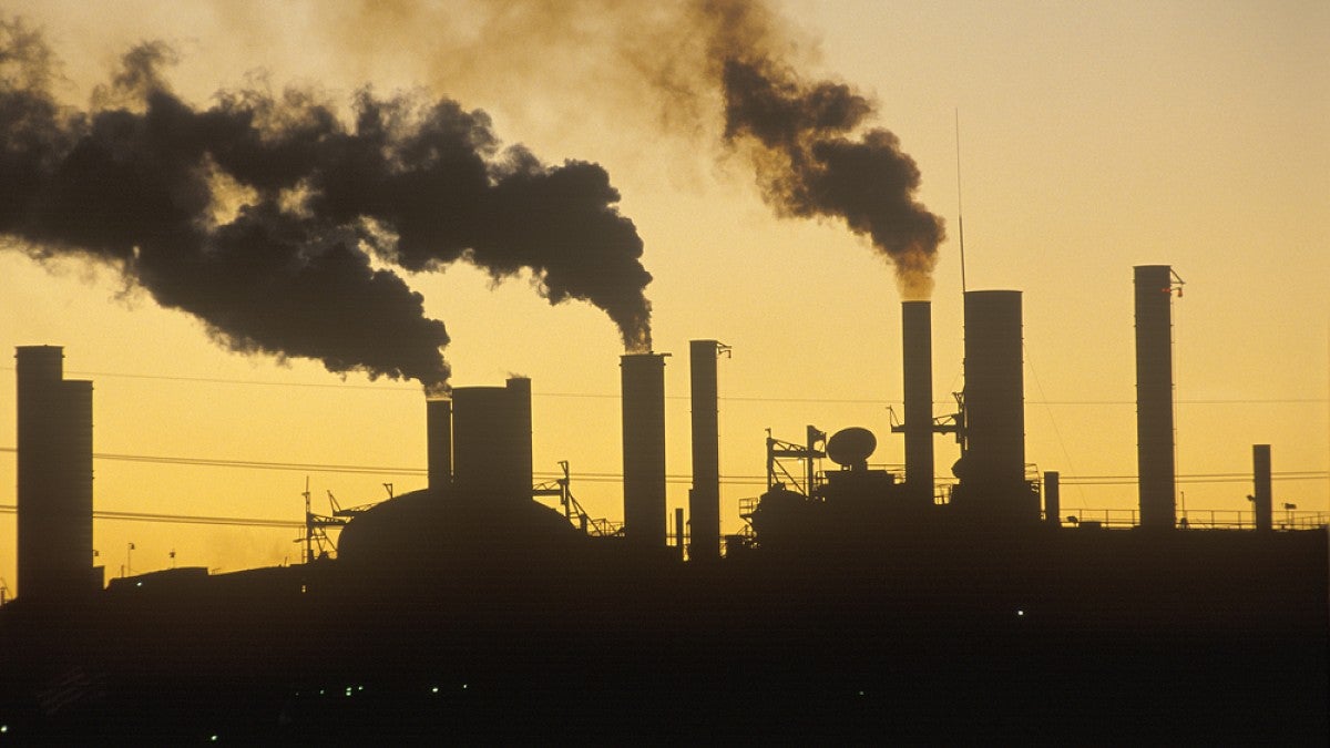 Silhouette of smokestacks