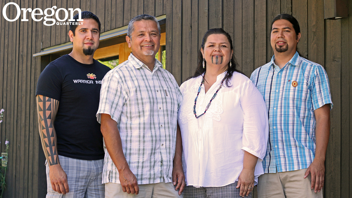 Guylish Bommelyn, Loren Bommelyn, Marva Jones, and Pyuwa Bommelyn outside the UO's Many Nations Longhouse during the Northwest Indian Languages Summer Institute. Photograph by Jack Liu