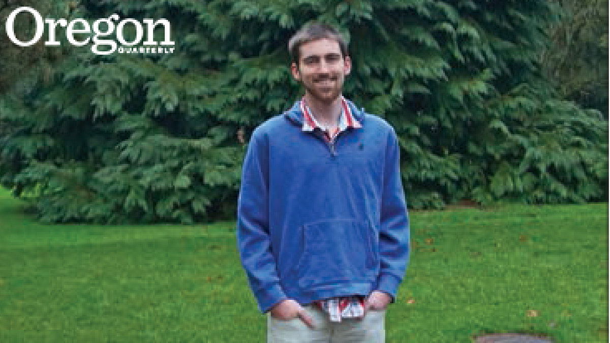 Conner Gordon stands in front of a giant Port Orford cedar located on the UO campus between Deady and Allen Hall. Photograph by John Bauguess