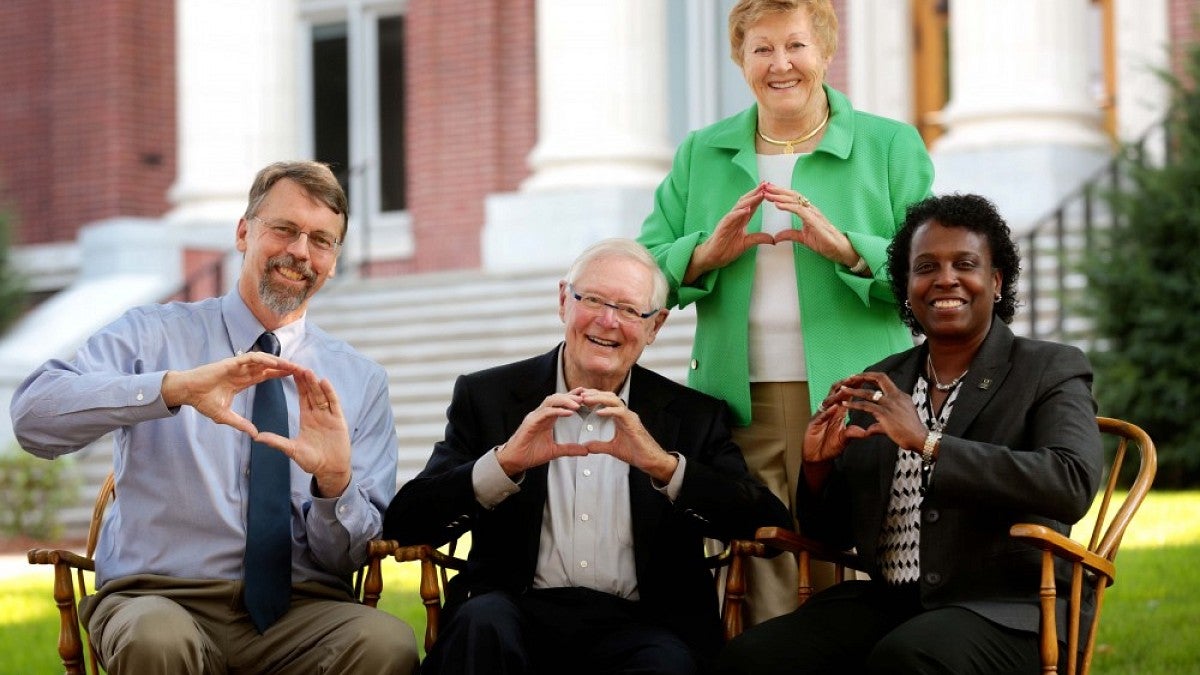 CAS interim Dean W. Andrew Marcus, Don Tykeson, Vice President for Student Life Robin Holmes (seated, from left) and Willie Tykeson