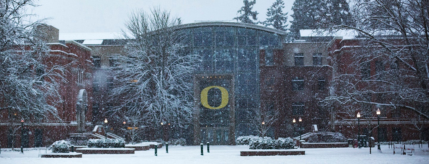 Snow surrounds the entrance to Lillis Business Complex