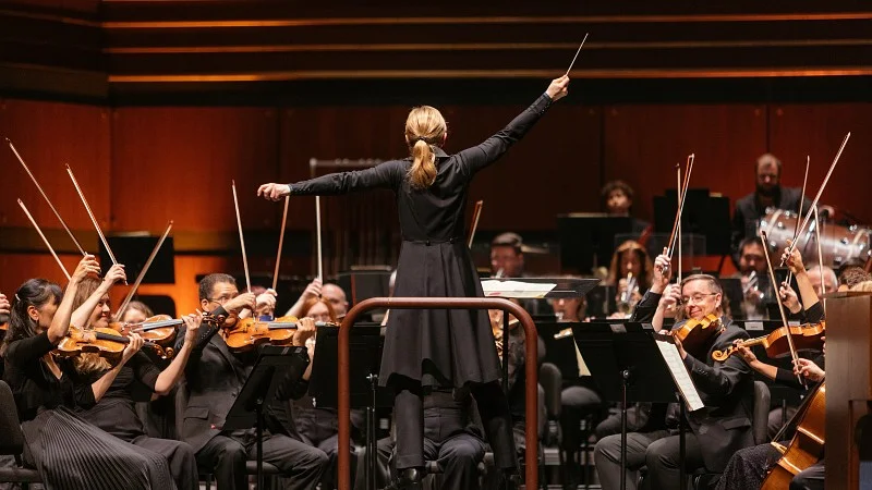 Conductor directing an orchestra 