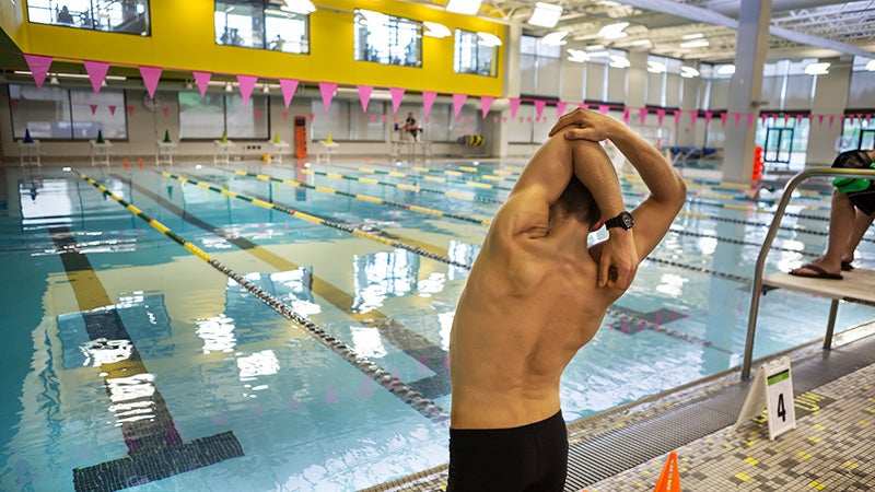 Student at indoor pool.
