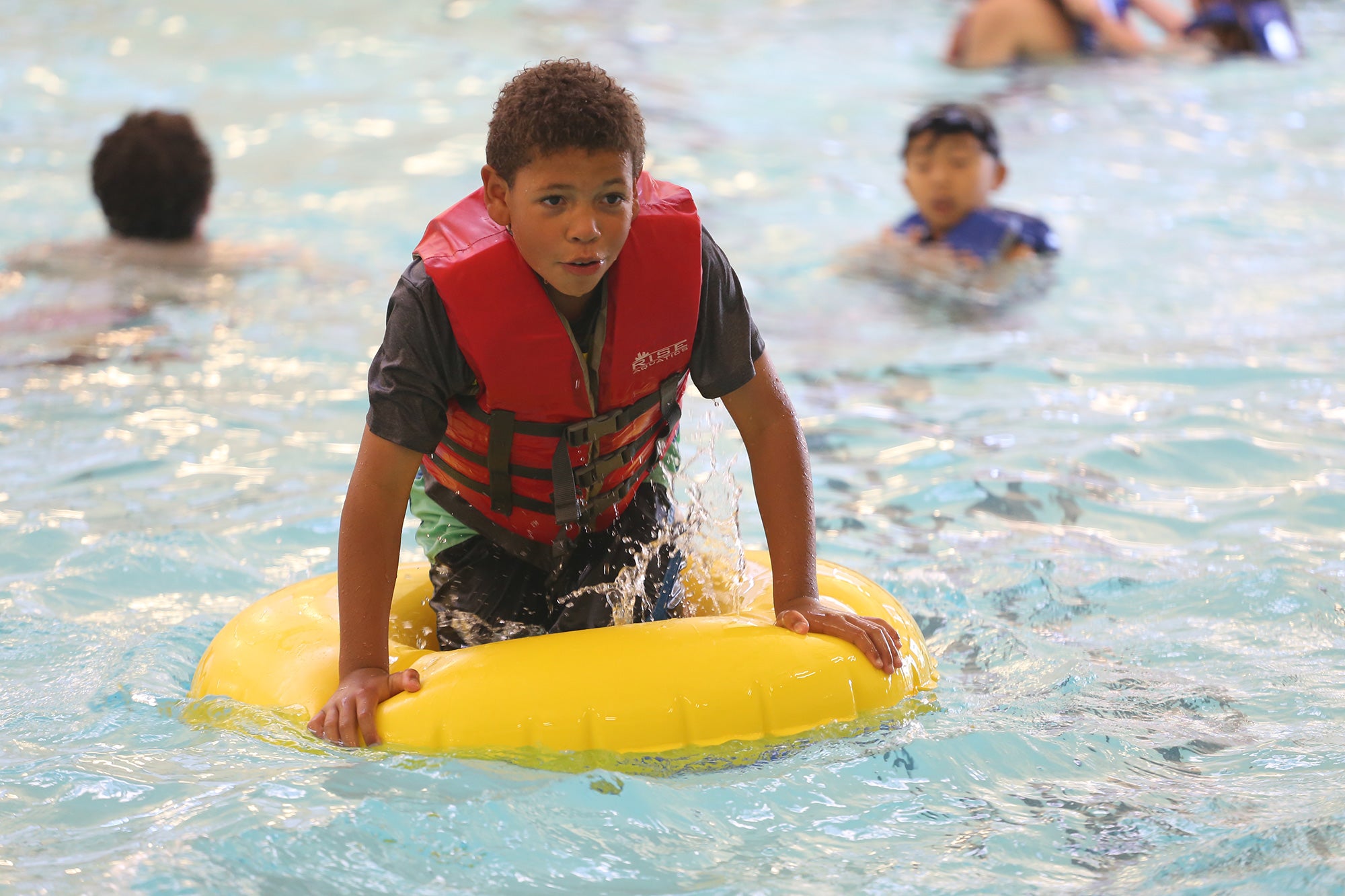 Dominic Turner on an inner-tube in Downtown Aquatics