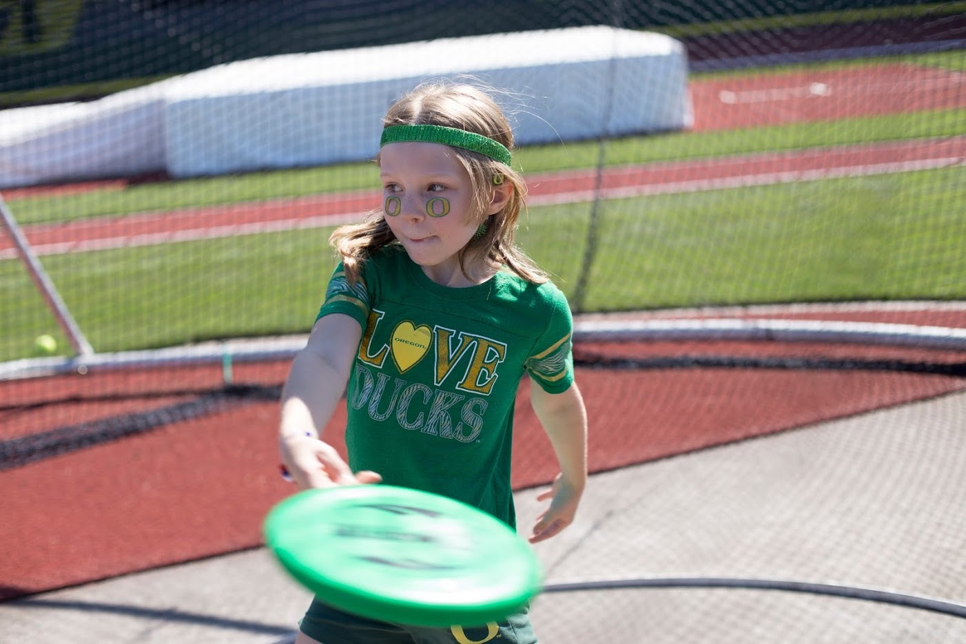 Child playing frisbee.
