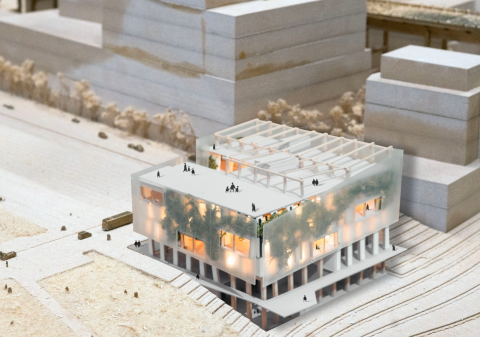 A model of a building and surrounding buildings with plants and lights inside the building.  