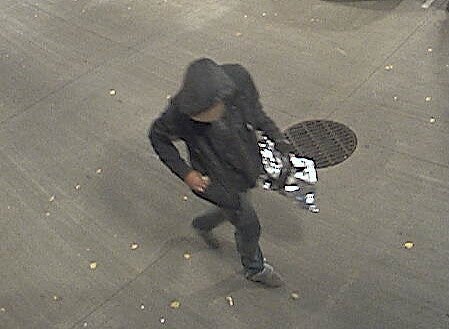 Suspect in trash container fire.