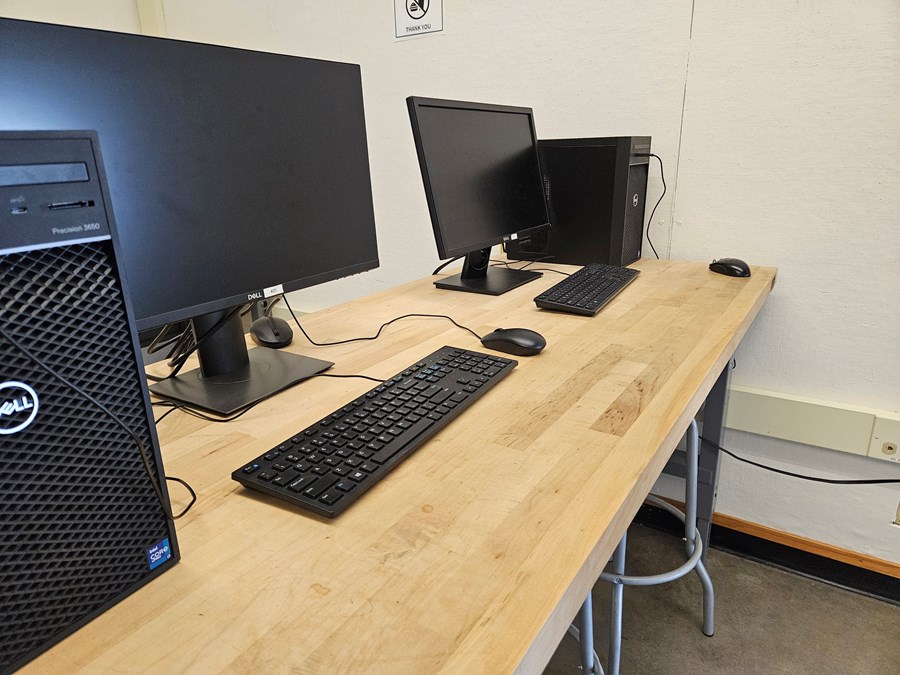 Close view of two computer lab stations within the Lawrence Room 383 computer lab.
