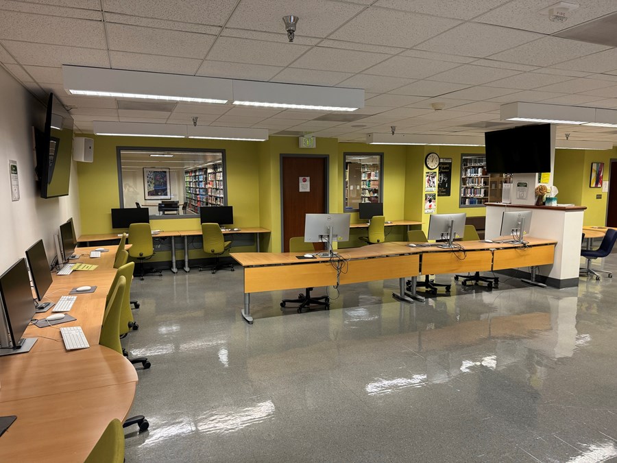 The Cinema Studies Classroom with PCs on desks with rolling chairs