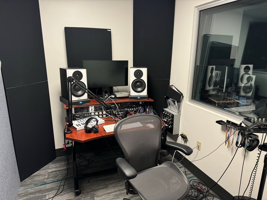 Studio monitor room with a computer and audio equipment