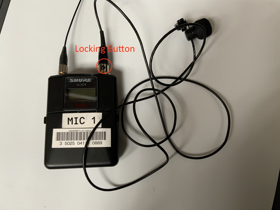 Mic pack with locking button highlighted