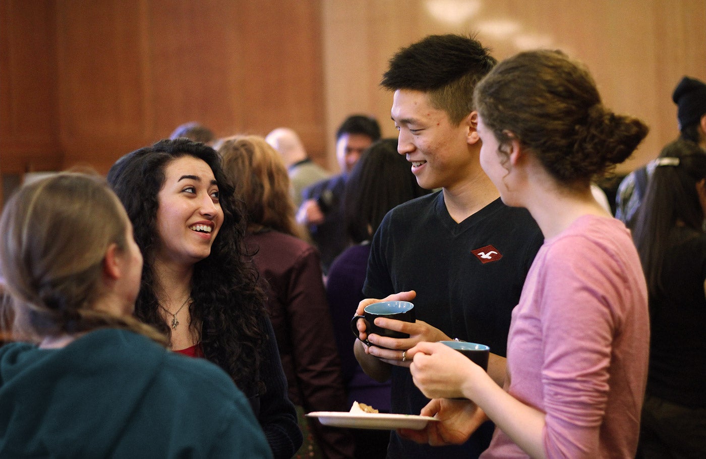 A group of students chat during a meet and greet.