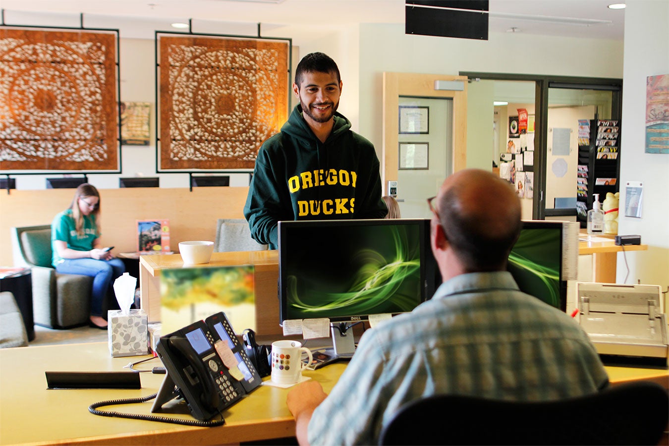 A student checking into the Counseling and Testing Center.
